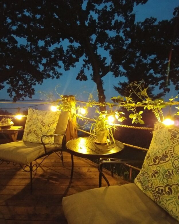 Patio with chairs and outdoor lighting